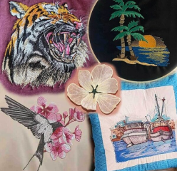 Various machine embroidery designs including tiger, cherry blossoms, etc.
